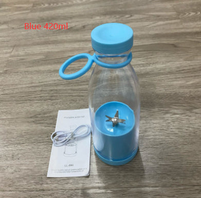 Clear bottle with blue lid and base, featuring a small blade, on a wooden surface.